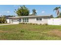 Well-kept single-story home showcasing manicured lawn, modern windows, and a welcoming facade at 3490 57Th St, St Petersburg, FL 33710