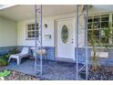 Charming front porch with seating and a decorative entryway at 3910 14Th N Ave, St Petersburg, FL 33713