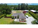 Spacious backyard features a barn and outbuildings at 408 River Bed Ct, Wimauma, FL 33598