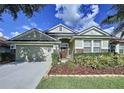 Beautiful one story home with a two car garage and tasteful landscaping at 4116 Knollpoint Dr, Wesley Chapel, FL 33544