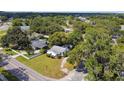 Corner lot home featuring a manicured lawn and mature trees at 5906 12Th St, Zephyrhills, FL 33542