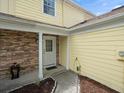 Charming porch with brick siding, providing curb appeal to the home's exterior at 6114 Oak Cluster Cir, Tampa, FL 33634