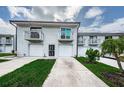 Charming townhome boasts a private balcony, garage, and lush green lawn at 6206 92Nd N Pl # 3605, Pinellas Park, FL 33782