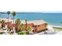Orange condos are surrounded by tropical greenery with water view and private boat dock at 7430 Sunshine Skyway S Ln # 602, St Petersburg, FL 33711
