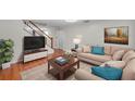 Inviting living room with hardwood floors, soft lighting and a large picture window at 8074 37Th N Ave, St Petersburg, FL 33710