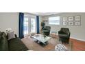 Comfortable living room with large windows and access to the outdoors at 8074 37Th N Ave, St Petersburg, FL 33710
