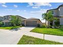 Inviting single-story home with well-kept lawn and a two-car garage at 9437 Lemon Drop Loop, Sun City Center, FL 33573