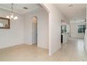 Bright and airy living room featuring neutral walls and tile flooring throughout at 11918 Winterset Cove Dr, Riverview, FL 33579