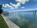 Calm waterfront view showing the intracoastal waterway with blue skies and fluffy white clouds at 413 Midway Is, Clearwater Beach, FL 33767