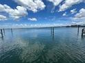 Calm waterfront view showing the intracoastal waterway with blue skies and fluffy white clouds at 413 Midway Is, Clearwater Beach, FL 33767