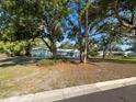 Exterior of home with well-manicured lawn and lots of shade trees at 4404 Hickory Branch Ct, Brandon, FL 33511