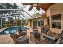 Relaxing screened-in lanai with a beautiful pool and comfortable seating area at 4736 Stonebriar Dr, Oldsmar, FL 34677