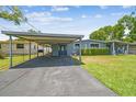 Inviting single-story home featuring a carport and well-maintained front yard at 5015 S 88Th St, Tampa, FL 33619