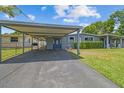 Inviting single-story home featuring a carport and well-maintained front yard at 5015 S 88Th St, Tampa, FL 33619