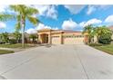 Beautiful single-story home with a two-car garage, well-manicured lawn, and inviting curb appeal at 5309 Spectacular Bid Dr, Wesley Chapel, FL 33544
