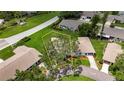 Aerial view showcasing the property's boundaries, surrounding landscape, and proximity to nearby streets and homes at 1214 Haddington Cir # 1214, Sun City Center, FL 33573