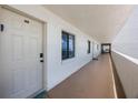 Exterior hallway with views of the ocean from multiple windows at 14950 Gulf Blvd # 902, Madeira Beach, FL 33708