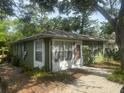 Exterior view of the home showcasing its architecture and well-maintained surroundings at 159 6Th Nw St, Largo, FL 33770