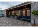 Charming front entrance featuring double doors, stone walkway, and inviting curb appeal at 16106 6Th E St, Redington Beach, FL 33708