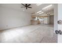Open-concept floorplan featuring vaulted ceilings with skylights and a ceiling fan at 208 Oakwood Blvd, Oldsmar, FL 34677