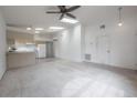 Bright living room featuring vaulted ceilings with skylights and a ceiling fan at 208 Oakwood Blvd, Oldsmar, FL 34677
