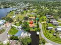 Aerial view of a waterfront property with canals, lush greenery and private boat dock at 301 Carlyle Blvd, Ruskin, FL 33570