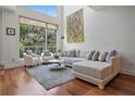 Bright living room with high ceilings, large windows, and a comfortable seating arrangement at 325 5Th S Ave # 9, St Petersburg, FL 33701
