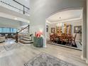 Grand foyer view showcasing hardwood floors, an elegant dining room, and an open floorplan at 33668 Willow Point Ct, Wesley Chapel, FL 33545