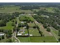 Expansive property featuring a pool, outbuildings, and mature trees on a large lot at 3412 Ace Ln, Dover, FL 33527