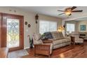 Comfortable living room with hardwood floors, a decorative door, and plenty of seating at 4206 W Palmira Ave, Tampa, FL 33629