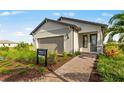 Charming single-story home featuring a neutral color palette, attached garage, and beautiful landscaping at 4547 Gardner St, Bradenton, FL 34210