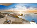 Relaxing balcony view with lounge chair, side table, and stunning waterfront scenery at 5701 Bowen Daniel Dr. # 806, Tampa, FL 33616
