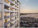 View of multiple condo balconies with outdoor furniture and waterfront views at 5701 Bowen Daniel Dr. # 806, Tampa, FL 33616
