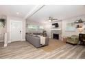 Bright living room featuring a decorative fireplace, neutral colors, and hardwood floors at 615 6Th N Ave, Safety Harbor, FL 34695