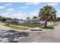 Charming single-story home featuring a well-maintained yard, fenced perimeter, and mature landscaping at 6417 Willow Wood Ln, Tampa, FL 33634