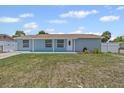 Charming single-story home featuring a well-maintained lawn, trimmed shrubs, and private driveway at 6417 Willow Wood Ln, Tampa, FL 33634