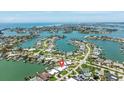 Captivating aerial view of a waterfront property showcasing the community's canal system and surrounding residential areas at 7892 10Th S Ave, St Petersburg, FL 33707
