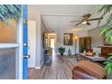 The living room is staged with modern furniture, neutral walls and a ceiling fan at 8080 112Th St # 108, Seminole, FL 33772