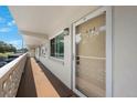 Inviting front door to unit 202, with a well-lit walkway and fresh paint at 8100 Dr Martin Luther King Jr N St # 202, St Petersburg, FL 33702