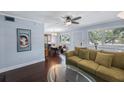 Comfortable living room with hardwood floors, ceiling fan, and plenty of natural light at 8100 Dr Martin Luther King Jr N St # 202, St Petersburg, FL 33702