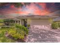 Charming single-story home with a well-manicured lawn, mature landscaping, and a two-car garage at 8515 Macoma Ne Dr, St Petersburg, FL 33702