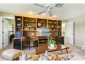 Comfortable living room featuring custom built-ins that offer ample storage and stylish display space at 8515 Macoma Ne Dr, St Petersburg, FL 33702