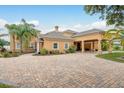 Spacious home exterior featuring a circular driveway, and portico entry area offering ample parking at 11430 Trotting Down Dr, Odessa, FL 33556