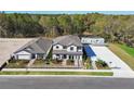 New construction homes with sidewalks and manicured landscaping along paved roadsides at 12801 Castle Oaks Dr, Hudson, FL 34669
