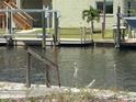Scenic waterfront view with private dock, providing convenient access to boating and water activities at 13605 Stacey Dr, Hudson, FL 34667