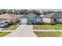 One-story home with garage, neat landscaping, and inviting curb appeal at 30217 Double Dr, Wesley Chapel, FL 33545