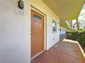 Unit 103 entrance featuring decorative glass on solid front door at 5603 80Th N St # 103, St Petersburg, FL 33709