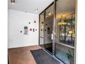 Building's entryway featuring glass doors, brick floors, and security access at 700 Beach Ne Dr # 602, St Petersburg, FL 33701