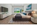 Spacious main bedroom featuring a large window with views of the outdoor living space at 937 Old Welcome Rd, Lithia, FL 33547