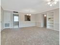 Bright and airy living space featuring an open layout, with a partial view of the kitchen at 10330 Carrollwood Ln # 95, Tampa, FL 33618